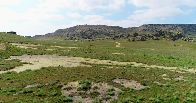 Uninhabited area surrounded by rocks and boulders. Drone shoot of Gobustan, Azerbaijan