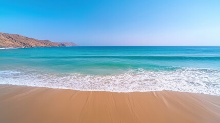 Fototapeta premium Máncora Beach : Serene beach with turquoise water and gentle waves under a clear sky. AI-generated.