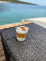 Whiskey Sour  A tart cocktail with whiskey, ice, cherry, and orange
