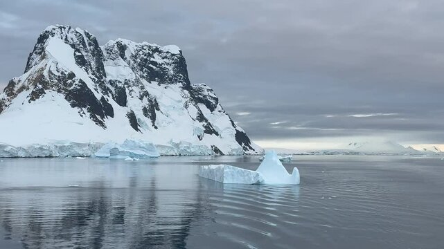 Big Iceberg in Antarctica Winter Scenery, Amazing Shape Ice Formation of Massive Large Enormous Blue Icebergs in Antarctic Peninsula Landscape Seascape with Ocean Sea Water