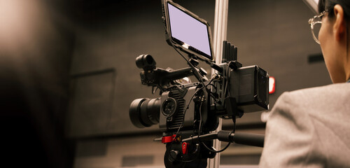Professional cinema cameras being used in a studio or event setting.  High end gear with crew...
