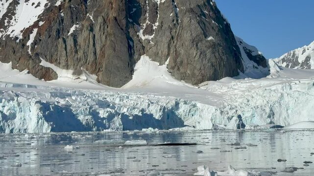 Big Iceberg in Antarctica Winter Scenery, Amazing Shape Ice Formation of Massive Large Enormous Blue Icebergs in Antarctic Peninsula Landscape Seascape with Ocean Sea Water
