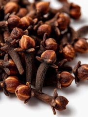 Pile of Dried Cloves on White Background