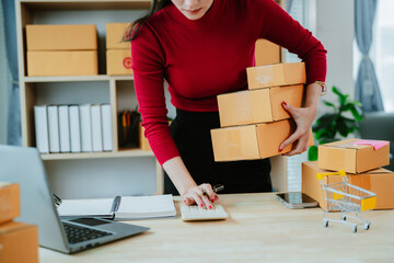 Portrait of Starting small businesses SME owners, two Asian woman check online orders Selling...