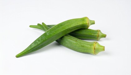 Okra Pods on Isolated White Background &ndash; Slender Green Capsules with Velvety Skin and Studio Lighting