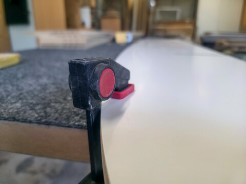 Tool used for shaping a surfboard during craftsmanship in a workshop environment at midday