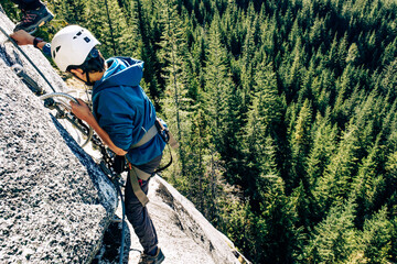 Climber on a cliff, Via Ferrata, Sea to Sky , Squamish, British Columbia, Canada