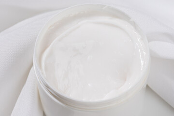 White Skin Brightening Cream with Satin Background