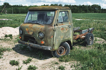 Abandoned Rusty Soviet-Era Truck UAZ in Rural Field