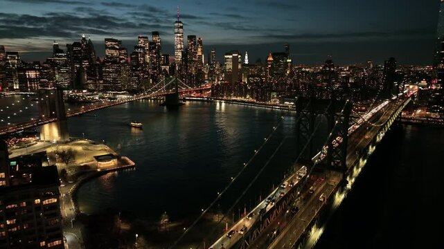 dusk flying counter clockwise view of bridges from Brooklyn to downtown NYC