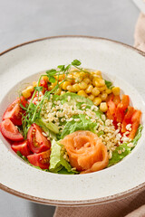 Vibrant Salmon Salad Bowl with Corn and Fresh Vegetables in Natural Light