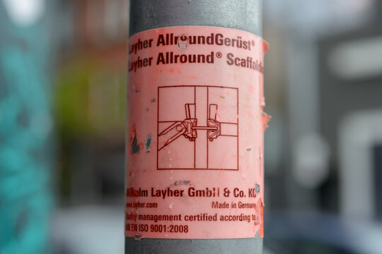 sticker sign on Allround Scaffolding tube or standard owned by Wilhelm Layher GmbH & Co KG, seen in Toronto