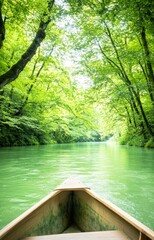 Obraz premium Exploring serene green river kayaking in lush forested environment