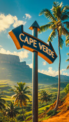 Fototapeta premium on the pole there is a direction arrow with the inscription Cape Verde against the background of a picturesque summer landscape 