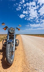 Obraz premium Motorcycle adventure on desert road scenic landscape daytime view