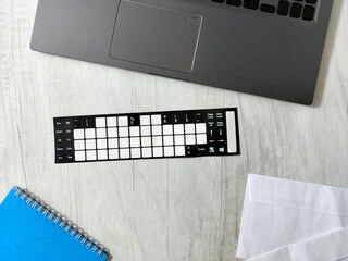 Workplace with laptop, envelopes, notebook, office desk, on a light wooden desk. Business,...