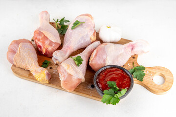 Food cooking background, raw chicken legs ready for grilling