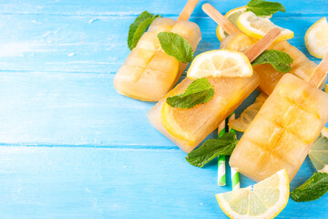 Iced tea or lemonade popsicles, sweet lemon and mint cocktail lollies