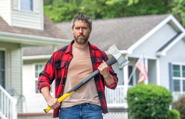 Lumberjack sweating hold heavy axe. Strong man work in neighborhood. Lumberjack men with axe....