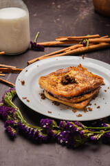 Traditional Latin American sweet bread toast with strawberry and milk, tropical setup

