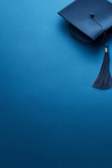 Graduation Cap on Blue Background Symbolizing Achievement and Education