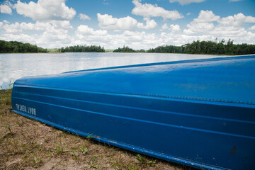 Rental row boat rests on exposed shoreline in northern Wiscconsin