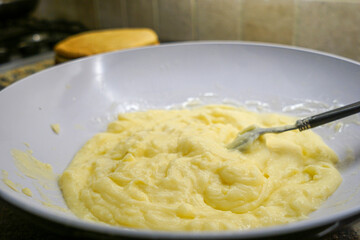 Making creamy custard at home. Homemade custard