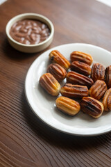 Close-up of churros dessert on a white vintage plate and hot chocolate