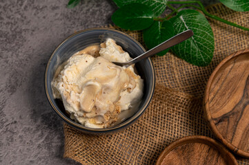 Homemade ice cream in a bowl on a concrete background. Homemade dessert.