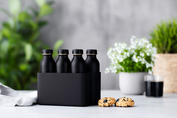 Stylish black soft drink bottle multipack mockup on white