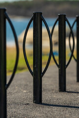 Close up view of black metal bike rack.