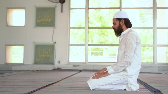 Devout Muslim man in sujood, the posture of deepest prostration in prayer. Submission and faith.