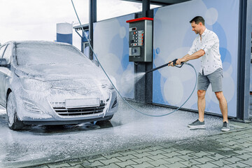 Spray car wash. Foam water bubbles soap. Self service detail pressure wet.