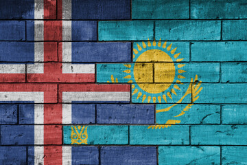 colourful painted big national flag of kazakhstan and flag of iceland on a massive old brick wall background. concept