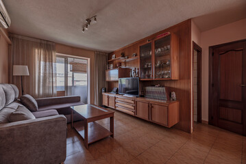 The centerpiece is often the sofa, complemented by armchairs,