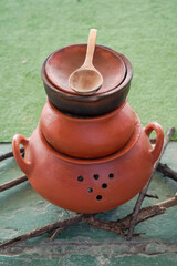 The beauty of culinary craftsmanship in a collection of earthenware pots, perfect to highlight the charm of ancestral cooking