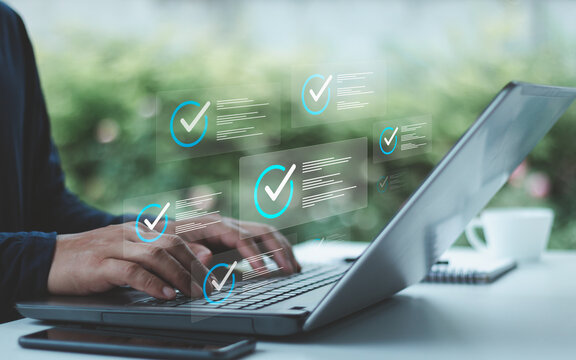 Business evaluation and performance tracking in cyberspace using online checklist survey assessment platform quality assurance technology digital form and review process. Businessman typing on laptop.