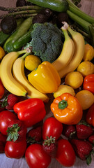 Rainbow of fresh fruits and vegetables – color-organized composition