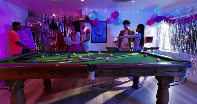 Eager for Dream Mania, Diverse friends around pool table carrying game box, assembling pieces