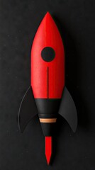 Red rocket on dark background. Round window on its body. Fins at the bottom