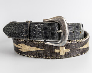 Black leather and woven belt with silver buckle and tribal pattern. Stylish and unique men's fashion accessory