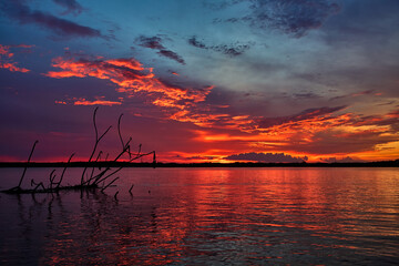 Golden hour magic over the mighty Amazonas River — where the sky ignites in fiery hues, and...