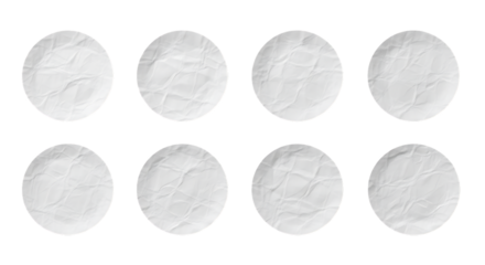 Eight White Paper Circles with Crumpled Texture Isolated on Black Background for Design Elements and Creative Projects