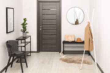Hallway with furniture and door, blurred view