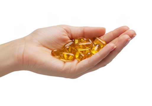 Isolated Image of Hand Holding Golden Omega Fish Oil Supplements