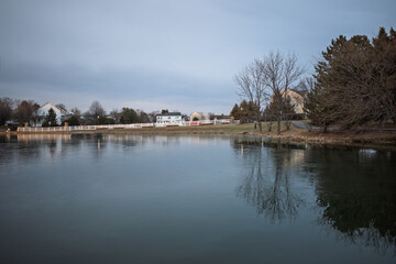 Early morning with partly frozen pond in a residential area in Ashburn, Virginia