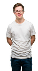 Fototapeta premium Isolated Portrait Man With Down Syndrome In White T-Shirt And Glasses