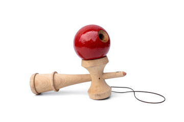 Vintage Old toys that have been played with there are traces damage of play. Cup and ball game Kendama traditional wooden japanese skill toy isolated on white background.