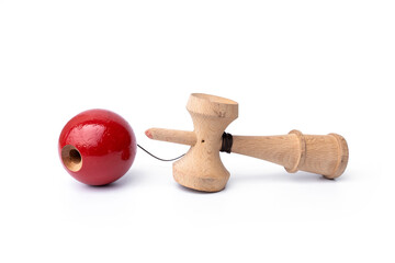 Vintage Old toys that have been played with there are traces damage of play. Cup and ball game Kendama traditional wooden japanese skill toy isolated on white background.