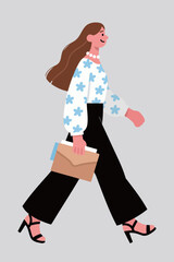 Walking Woman in Stylish Outfit holding Folder